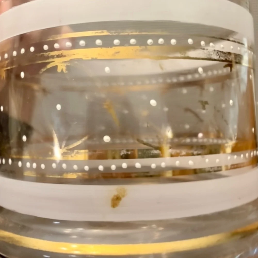 Elegant mid-century clear and frosted glass jar with gold accents.